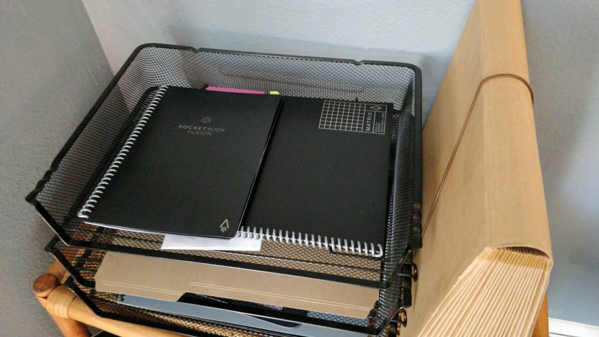 An tray containing two Rocketbooks
