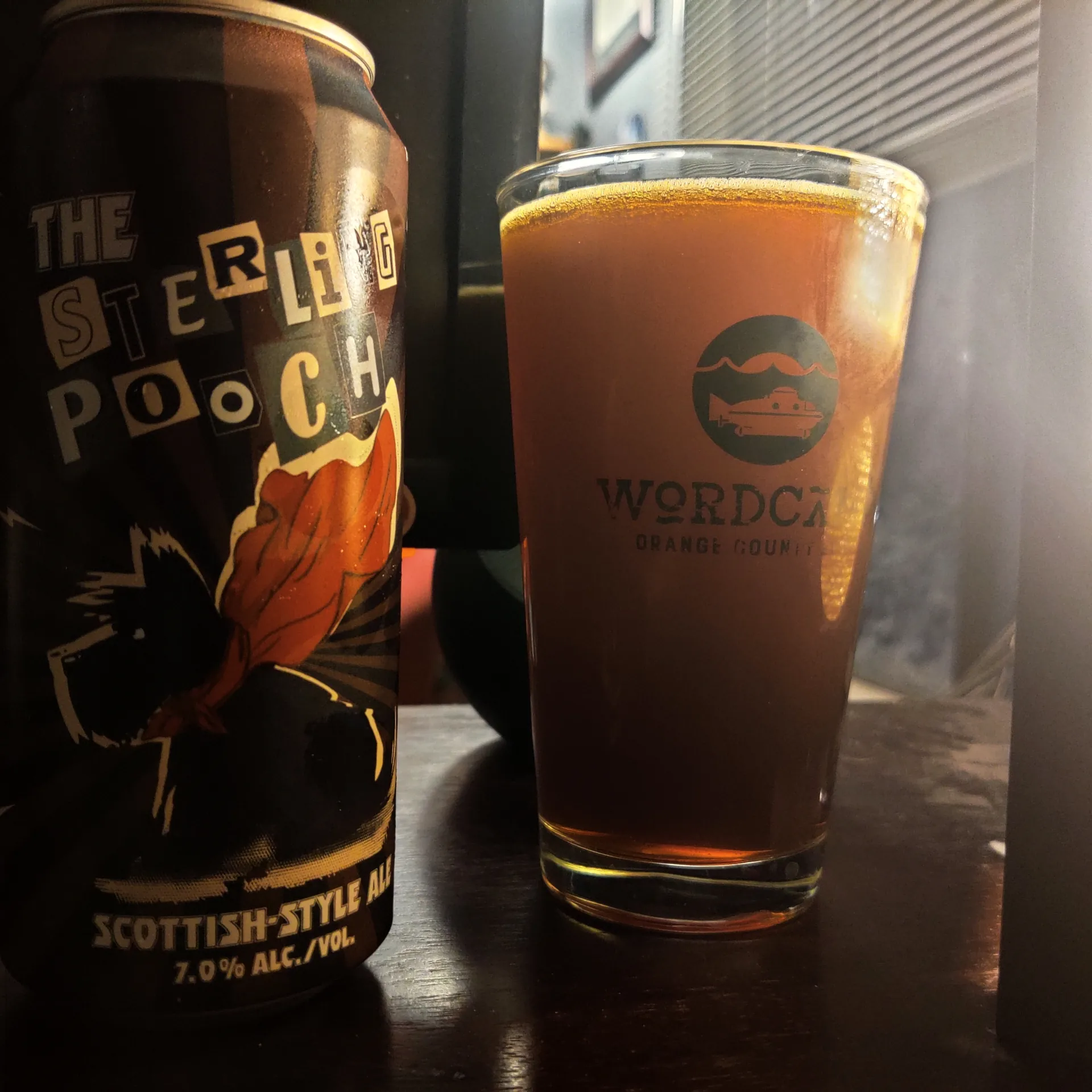 Can of beer next to a full glass